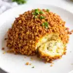 loaded football cheese ball with pretzel crust - featured image