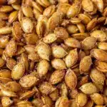 crispy baked cinnamon sugar pumpkin seeds - featured image