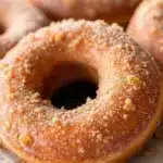crispy cinnamon sugar baked apple cider donuts - featured image